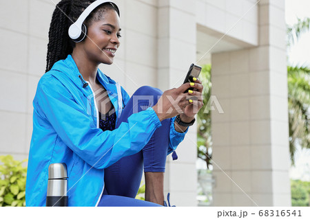 Woman checking workout mobile app 68316541