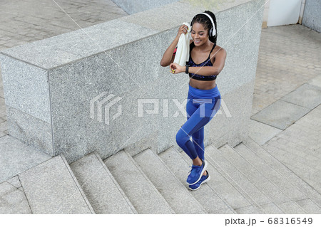 Sportswoman checking smartwatch Sportswoman checking smartwatch 68316549