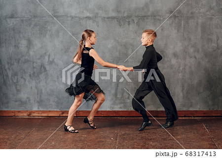 Young couple boy and girl dancing in ballroom dance Jive 68317413