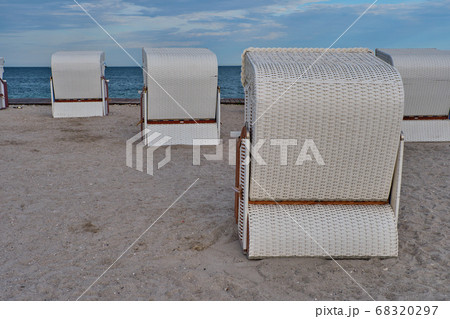 Empty beach cabins on a deserted beach. Empty beach cabins on a deserted beach. 68320297