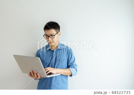 Side view Portrait of happy young businessman Side view Portrait of happy young businessman 68322735