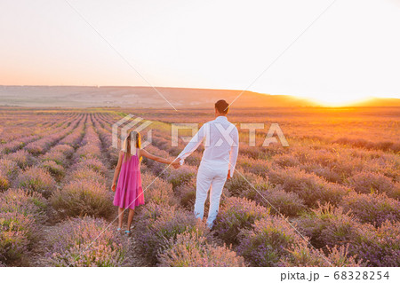 Family of two in lavender flowers field 68328254