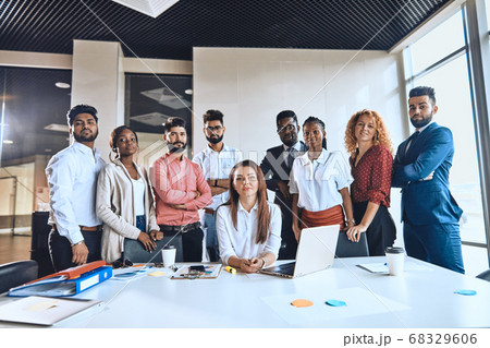 mixed race volunteers are looking at the camera indoors mixed race volunteers are looking at the camera indoors 68329606