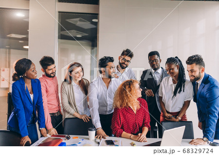 young diverse colleague respecting their female boss 68329724