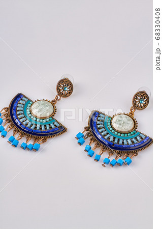 Ornamented decorative earrings isolated on white background. 68330408