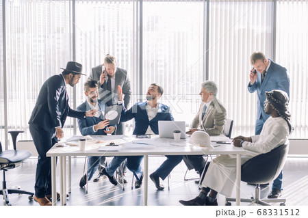 Serious male colleagues constructors checking sketch working in team cooperate 68331512