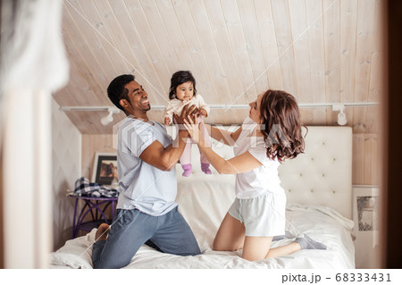 peasant gorgeous family having fun with a little kid 68333431