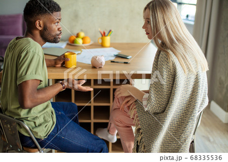 Relationship problems concept. Young mixed race couple quarelling at home. Relationship problems concept. Young mixed race couple quarelling at home. 68335536