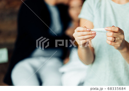 closeup of female holding thermometer 68335684