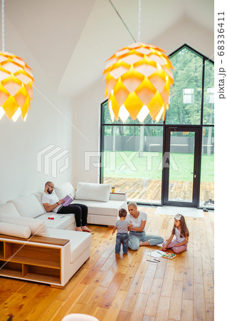 Family relaxing in holiday in big country house Family relaxing in holiday in big country house 68336411