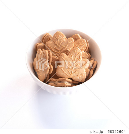 Canadian maple cookies in white caramic bowl isolated on white background 68342604