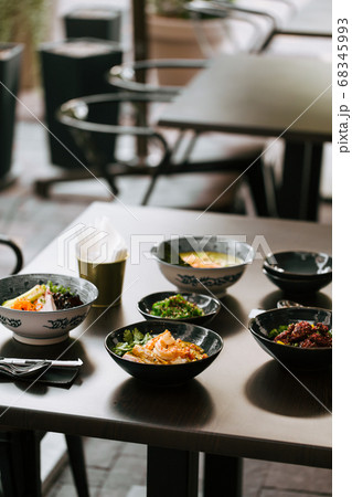 Dark table served with asian style japanese dishes 68345993