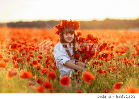 Little cute girl in white dress posing in wreath Little cute girl in white dress posing in wreath 68351355