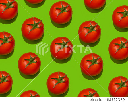 Set of tomatoes on a light green background.  68352329