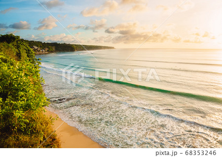 Coastline with beach, waves for surfing and warn sunlight in Bali Coastline with beach, waves for surfing and warn sunlight in Bali 68353246