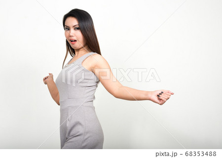 Portrait of Asian woman against white background 68353488