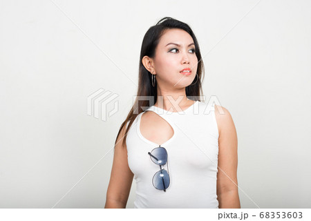 Portrait of Asian woman against white background 68353603
