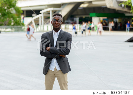 Young African businessman in the city outdoors 68354487