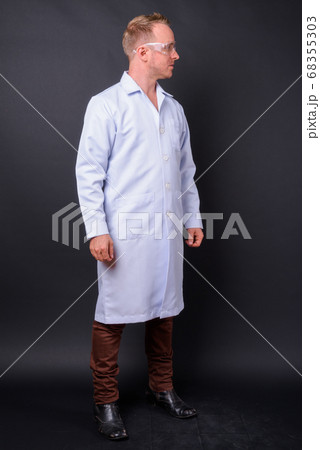 Portrait of handsome blond man doctor as scientist Portrait of handsome blond man doctor as scientist 68355303