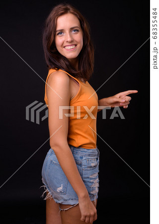 Portrait of happy young beautiful woman with brown hair Portrait of happy young beautiful woman with brown hair 68355484