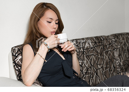 Young beautiful Asian woman in the living room at home 68356324