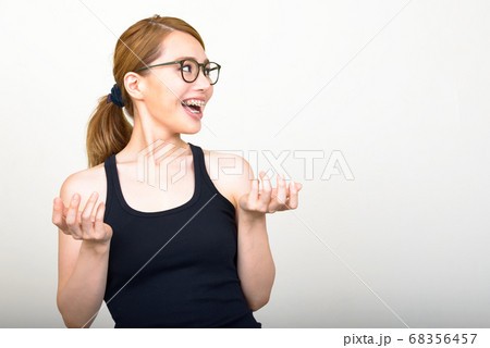 Portrait of happy young beautiful Asian woman 68356457