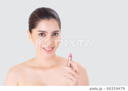 Beauty portrait young asian woman applying makeup with lipstick of mouth isolated. 68359479