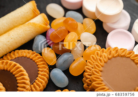甘いお菓子 グミとクッキーとラムネの写真素材