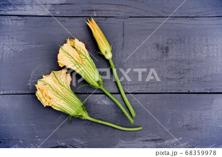 squash flowers on grey rustic table. 68359978