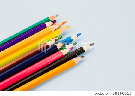 Pencils on a light blue background. Pencils on a light blue background. 68360619