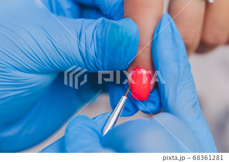 woman doing manicure in a beauty salon. Close-up of hands. 68361281