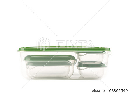Small plastic containers for storing food inside a large one isolated on a white background. 68362549