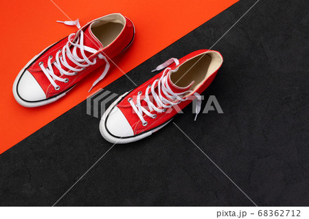 Minimal composition with summer footwear on black 68362712