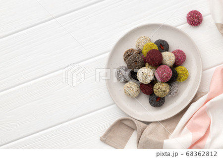 Colorful vegan candies energy balls on a plate on Colorful vegan candies energy balls on a plate on 68362812