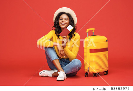 Ethnic woman dreaming about vacation Ethnic woman dreaming about vacation 68362975