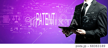 Patent concept with businessman using his tablet 68363189