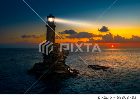The beautiful Lighthouse Tourlitis of Chora at night. Andros island, Cyclades, Greece 68363783