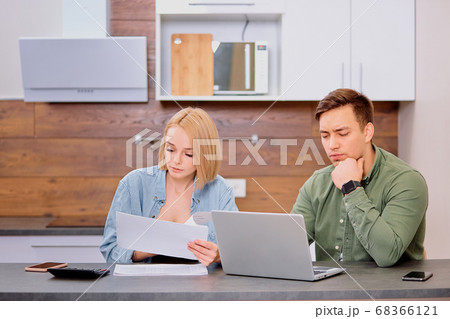 young couple planning budget,freelance,audit at home 68366121