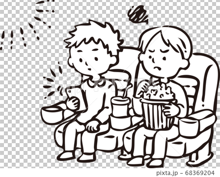 A man watching a smartphone during a movie screening A man watching a smartphone during a movie screening 68369204