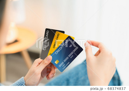 Hand holding credit card and pick take to shopping. Hand holding credit card and pick take to shopping. 68374837