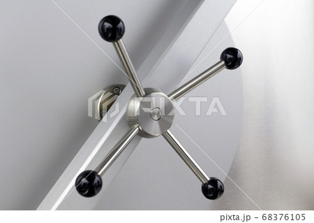 The closed solid bank vault iron door 68376105