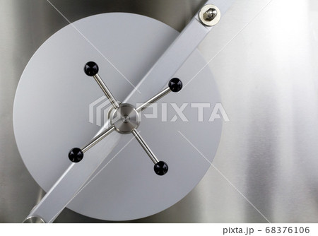 The closed solid bank vault iron door 68376106