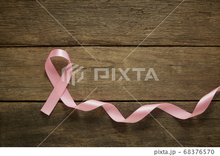 Pink ribbon on wooden breast cancer awareness 68376570