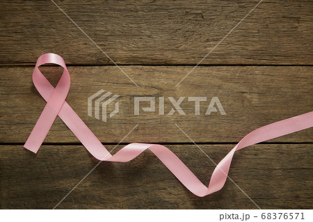 Pink ribbon on wooden breast cancer awareness 68376571