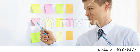 Worker holding notebook 68379377