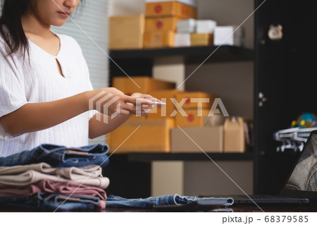 Clothing business owner is taking photos of their Clothing business owner is taking photos of their 68379585