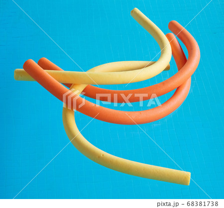 Aqua noodles floating in a indoor swimming pool Aqua noodles floating in a indoor swimming pool 68381738