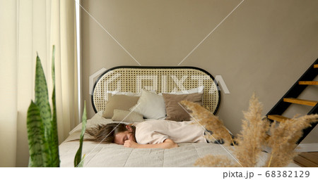 Tired woman after work. Falls on bed Tired woman after work. Falls on bed 68382129