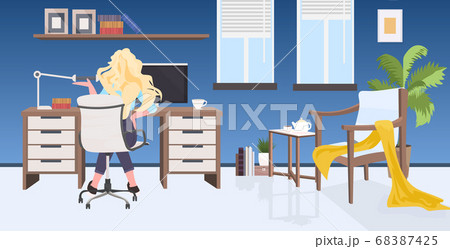 businesswoman sitting at workplace desk social distancing coronavirus epidemic protection self isolation 68387425