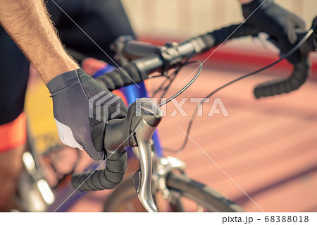 Close-up shot of bicycle handlebar and male hands 68388018